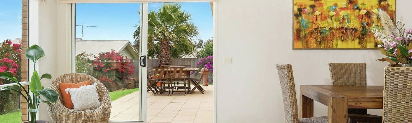 support-independent-living-sil-waurn-ponds-living-felicity-holistic-care SIL house in Waurn Ponds showing the living room, the terrace and the backyard