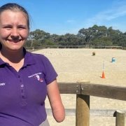 Abby Vidler, a 17-year-old with no forearms, smiles happily at the camera